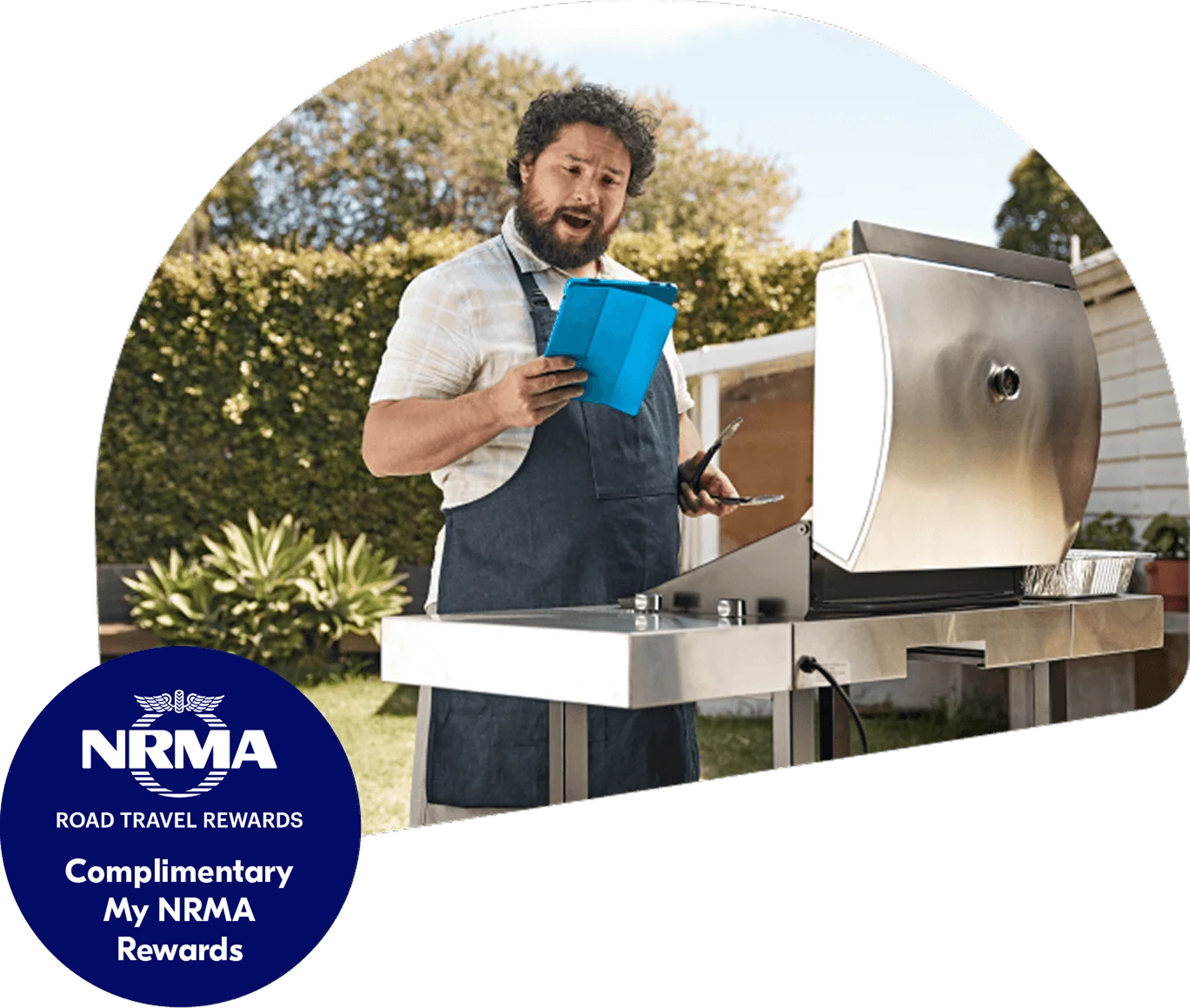 A man using a barbecue while looking at a tablet computer