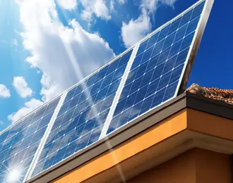 a solar panel on the roof of a house.